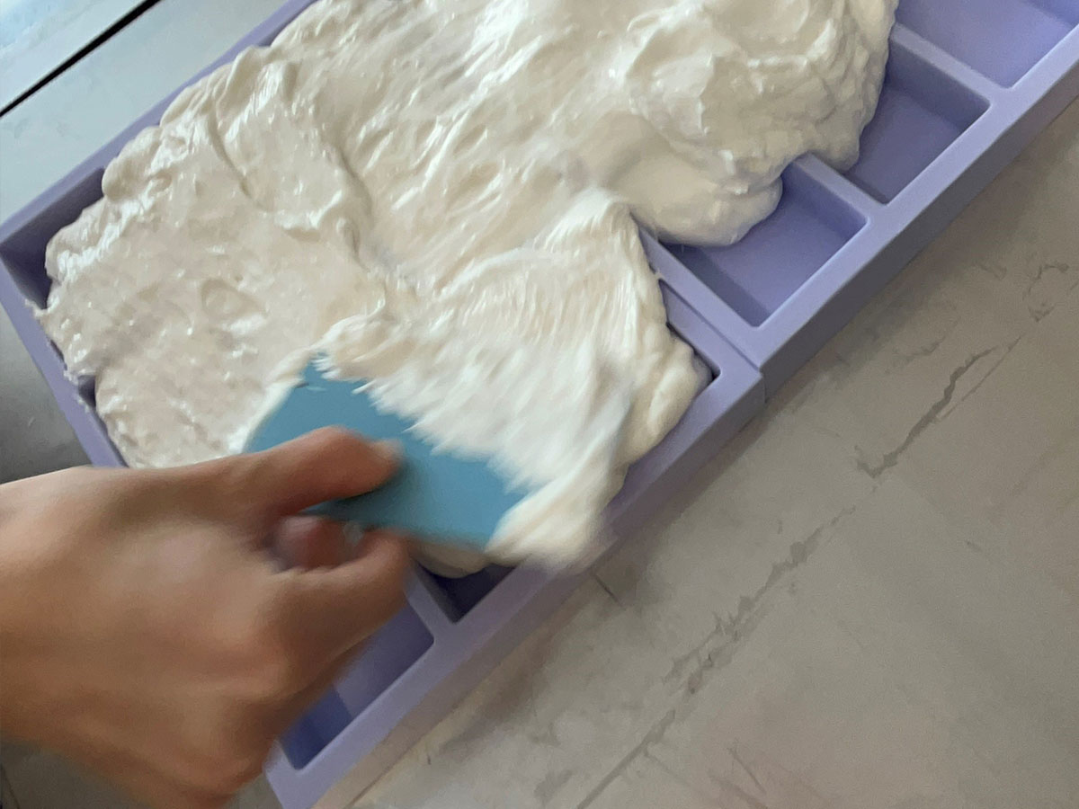Soap mass is poured into the silicone mould