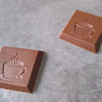 Coffee cup on a chocolate bar Coffee cup on a chocolate bar