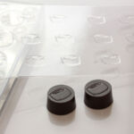 Individual logo praline for pralinenkurse.com realized with the chocopro system Praline mould chocopro